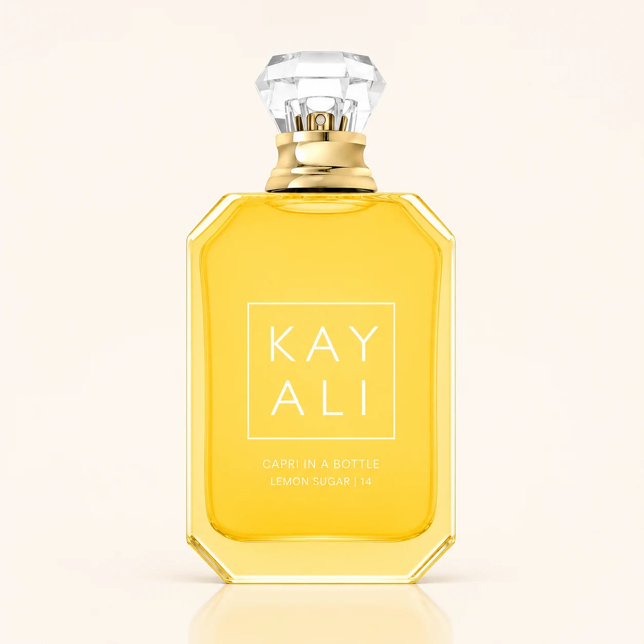 KAYALI Capri in a Bottle Lemon Sugar 14 EDP bottle on ivory background