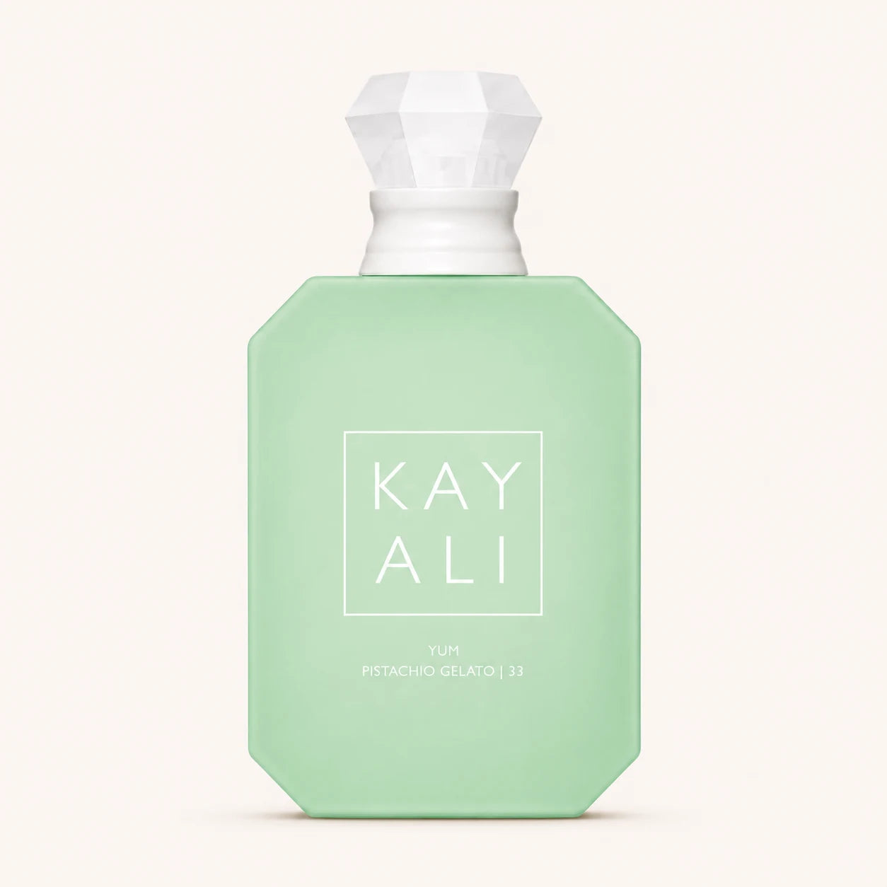KAYALI Yum Pistachio Gelato 33 EDP bottle on ivory background